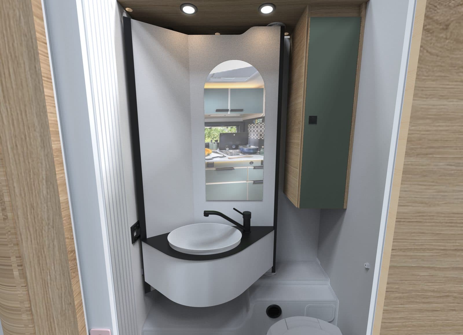Salle d'eau Vario du Chausson X650 : paroi pivotante portant un lavabo rond noir et un miroir, WC en dessous, meuble haut vert amande sur la droite