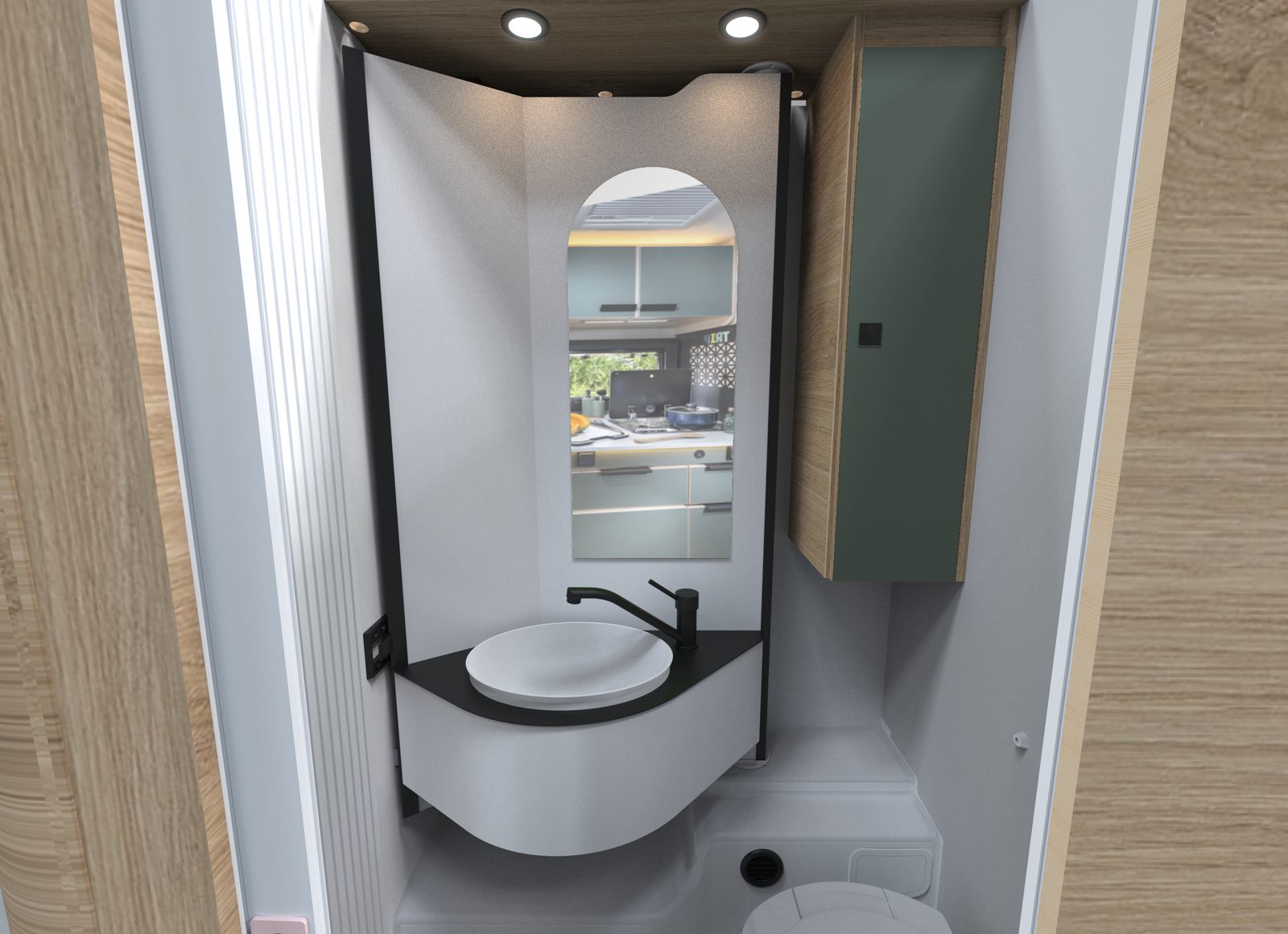 Salle d'eau Vario du Chausson X650 : paroi pivotante portant un lavabo rond noir et un miroir, WC en dessous, meuble haut vert amande sur la droite